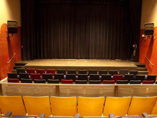 empty theatre seats and stage